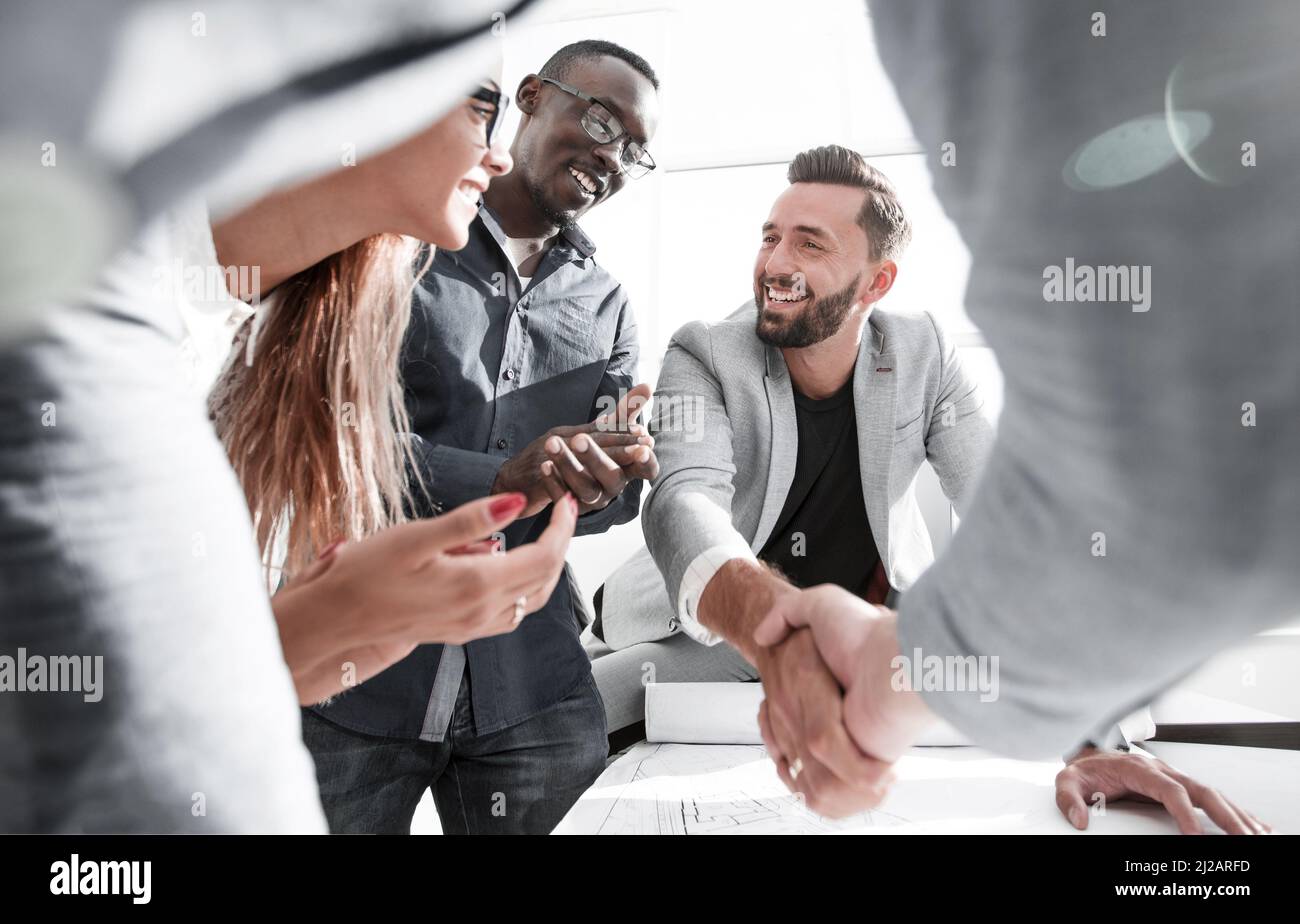 close up.architect and customer shaking hands Stock Photo