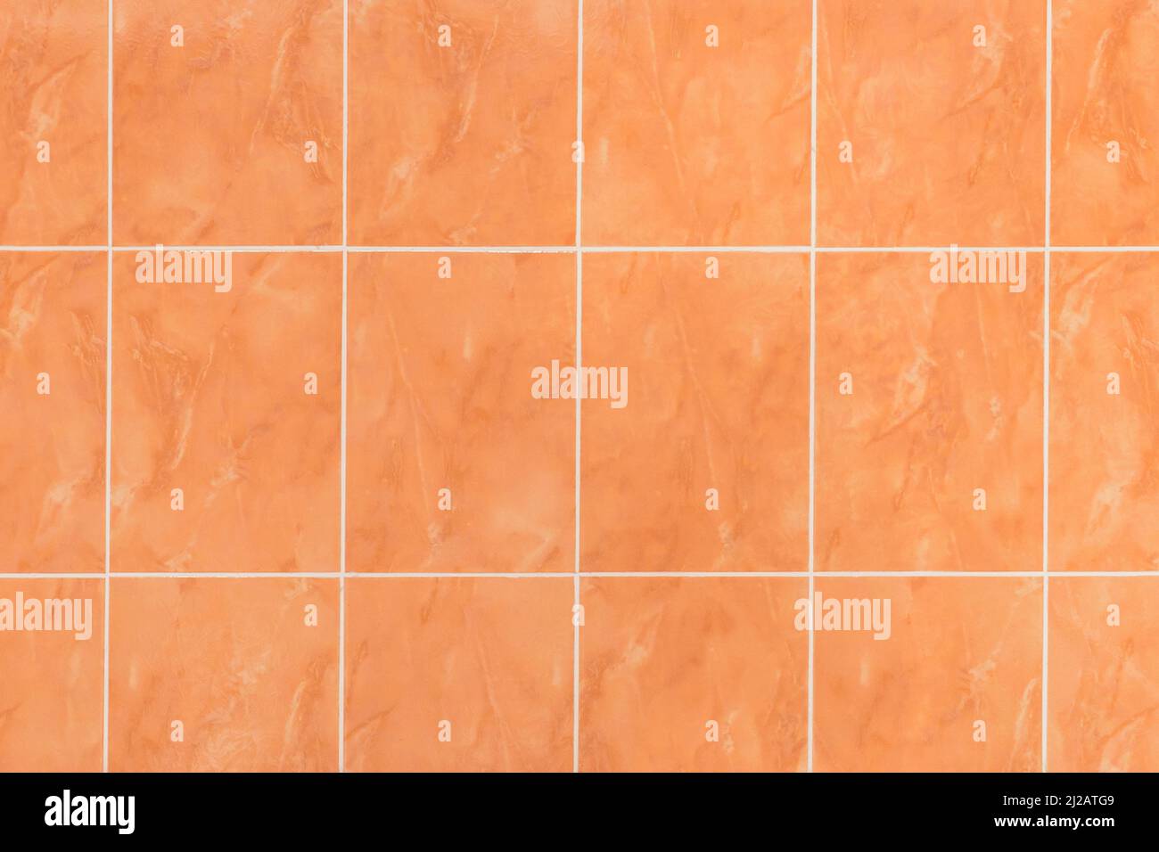 Wall orange ceramic tiles abstract interior design kitchen brown texture bathroom background sample. Stock Photo