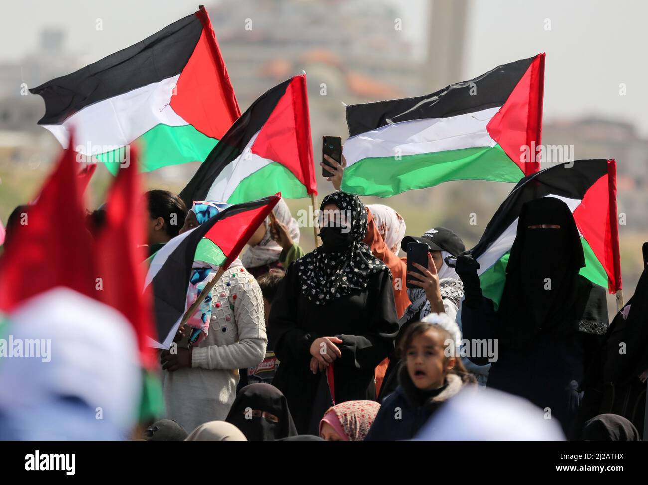 Gaza City. 30th March 2022. Palestinians participating at a march to commemorate the 46th anniversary of Earth Day, at the sea port in Gaza City. Stock Photo