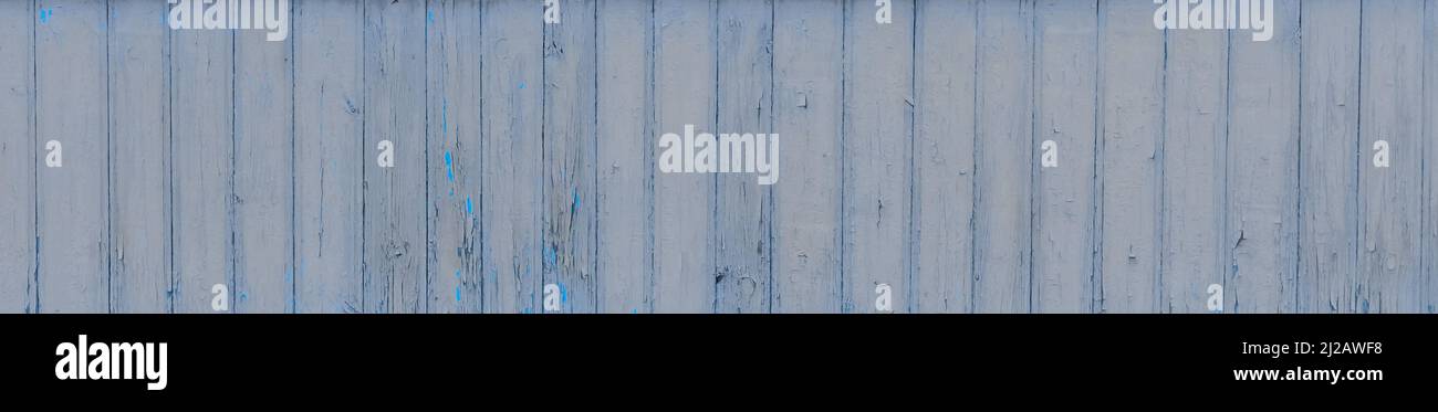 Old wooden worn fence boards weathered texture blue dirty obsolete plank background. Stock Photo