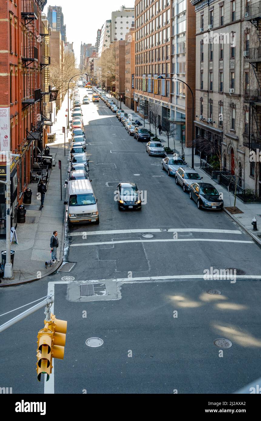 City street with parked cars and traffic in Chelsea aerial view from ...