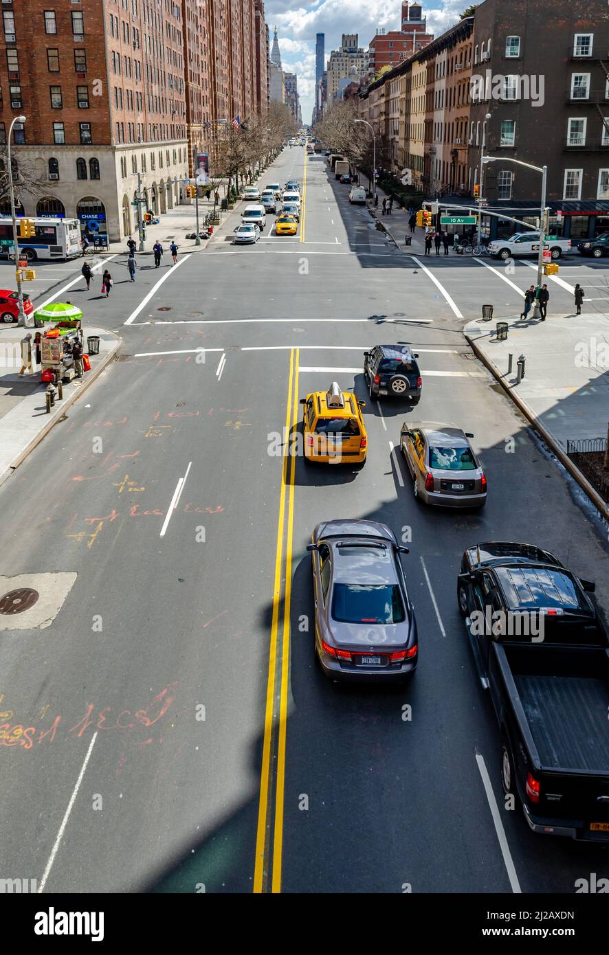 Chelsea City Street with traffic, yellow taxi cab and cars waiting on ...