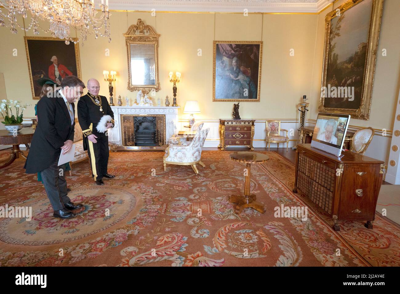 Queen Elizabeth II, in residence at Windsor Castle, appears on a screen(02)