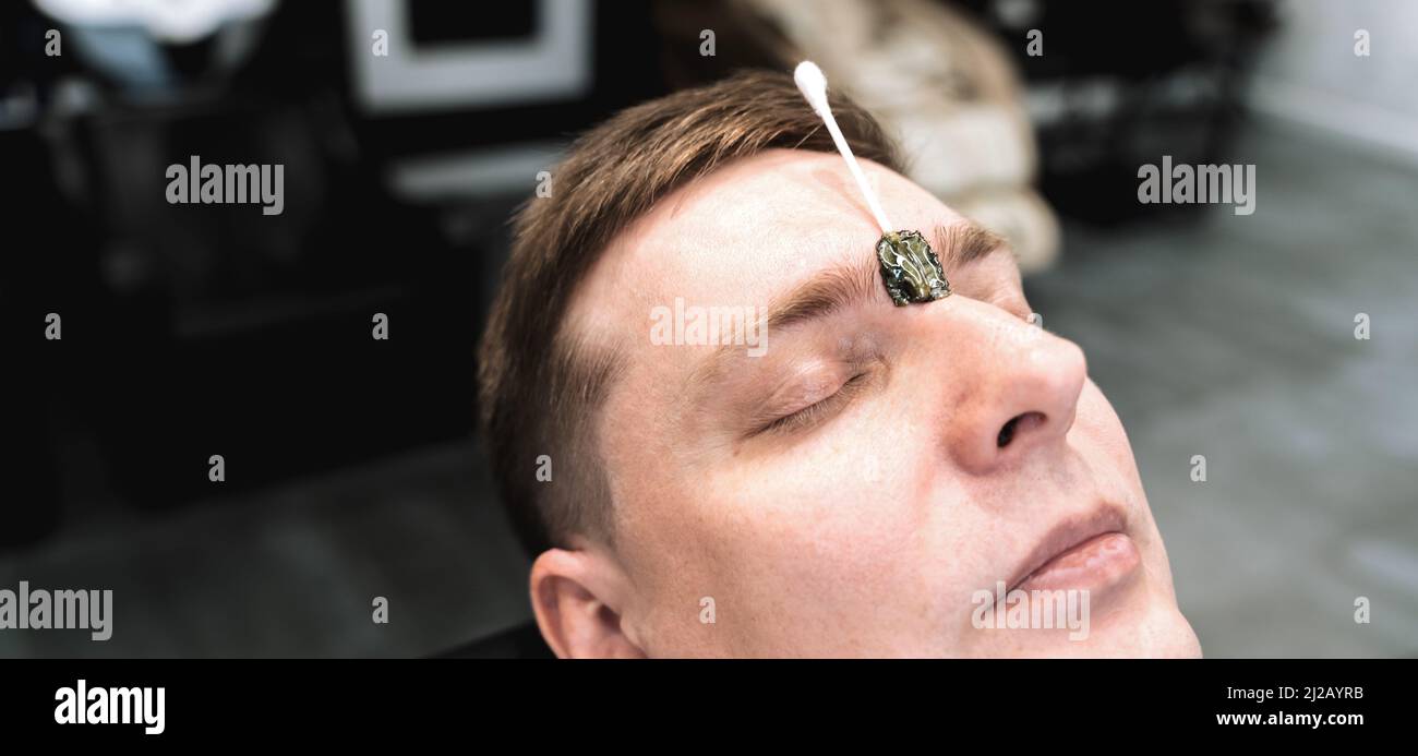 Visit to depilation,hair removal between the eyebrows