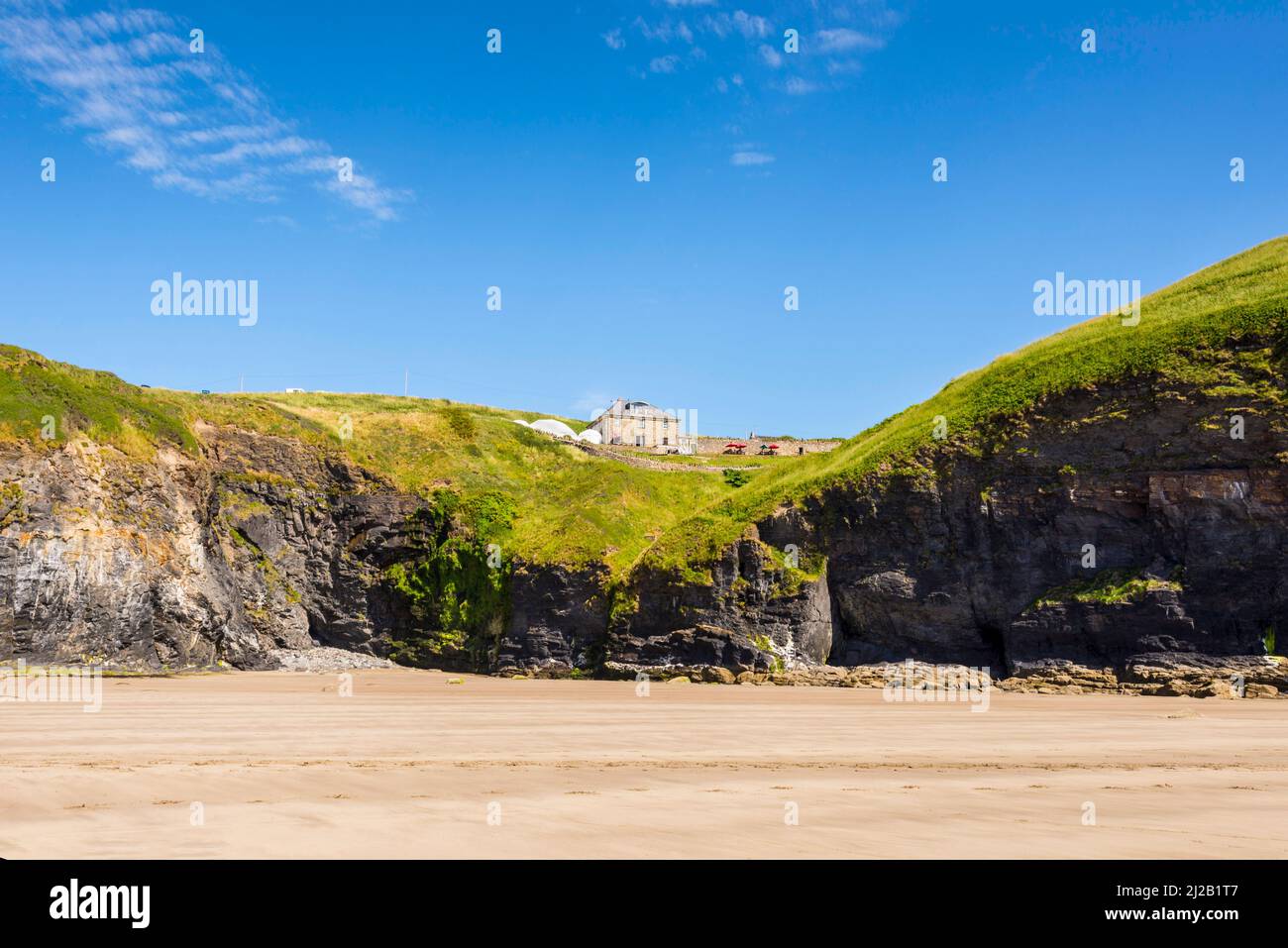 Druidstone Hotel in Pembrokeshire, shown in it's beautiful coastal environment by the clifftop overlooking Druidstone beach, on a sunny afternoon. Stock Photo
