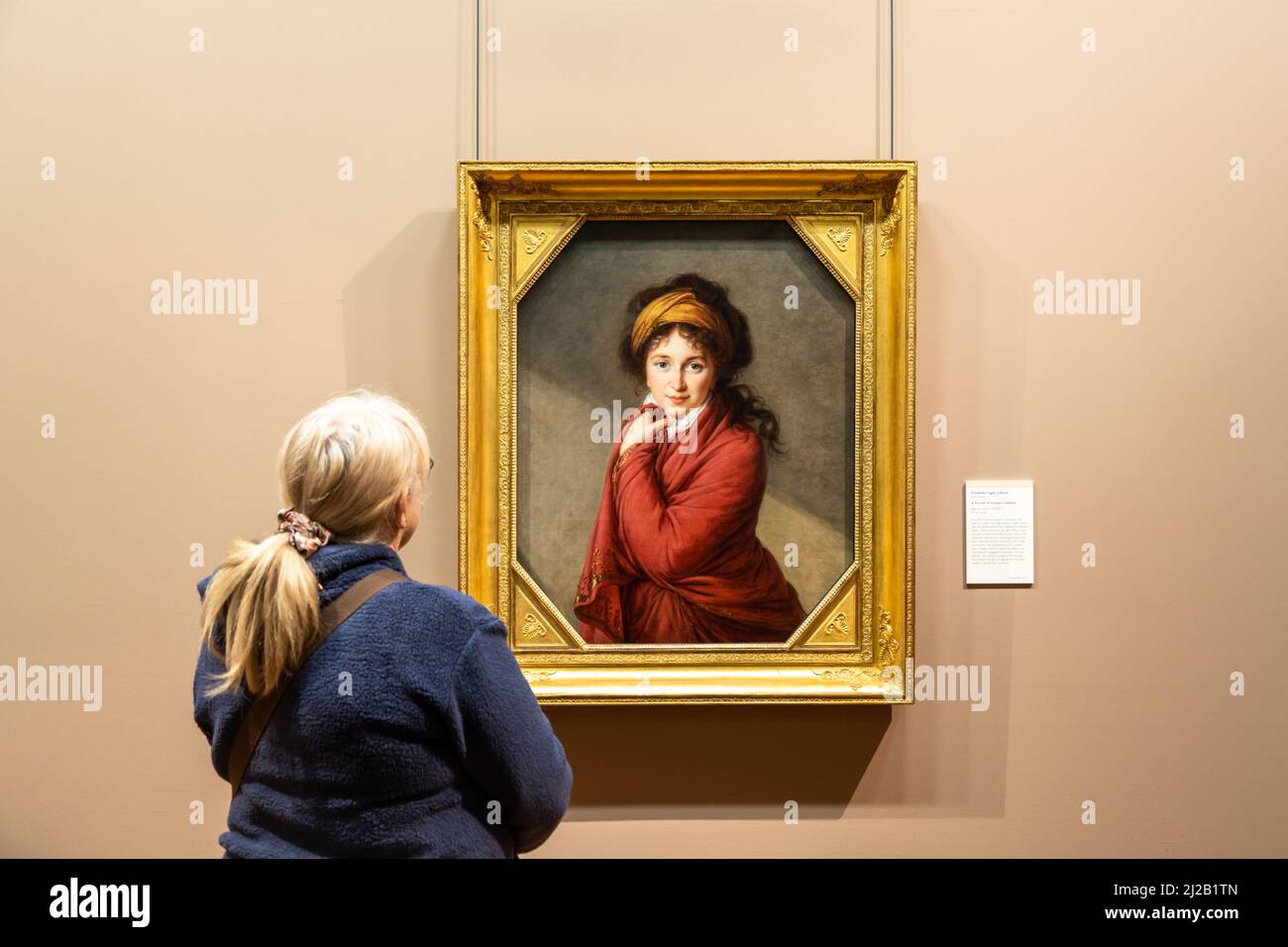 Woman looking a painting in the Barber Institute art gallery, Birmingham, UK 2022 Stock Photo