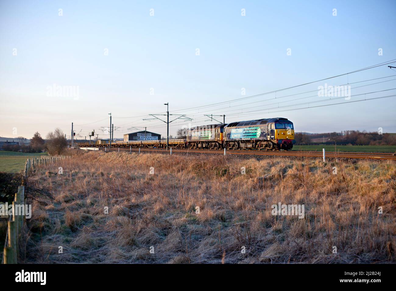 Direct rail Services class 57 locomotives 57003 + 57008 hauling a  freight train on the west coast mainline in Cumbria at Plumpton loop Stock Photo