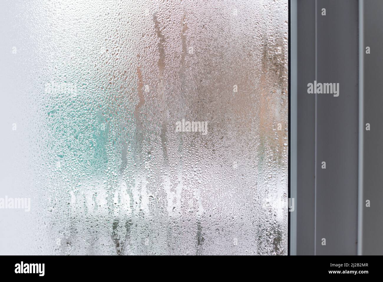 Glass with condensation, natural water drops on glass, high humidity ...