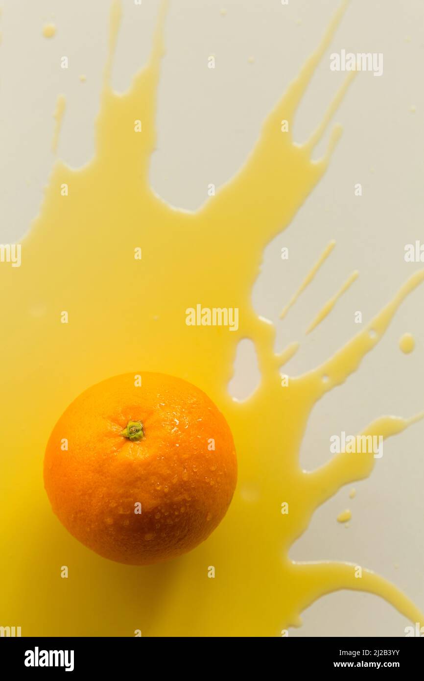 Spilled orange juice, creative photography Stock Photo Alamy