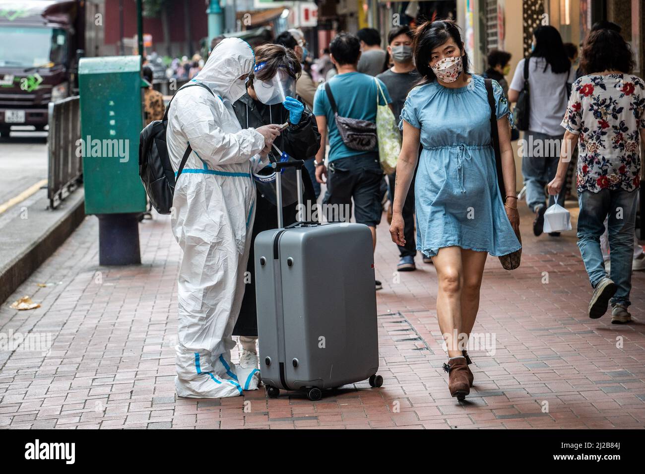 Hong Kong. 30th Mar, 2022. A man wearing a personal protective