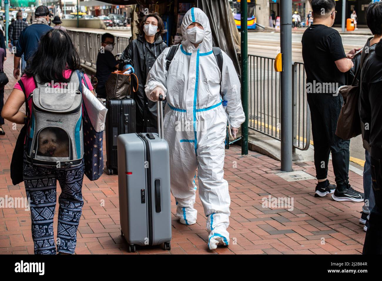 Hong Kong. 30th Mar, 2022. A man wearing a personal protective