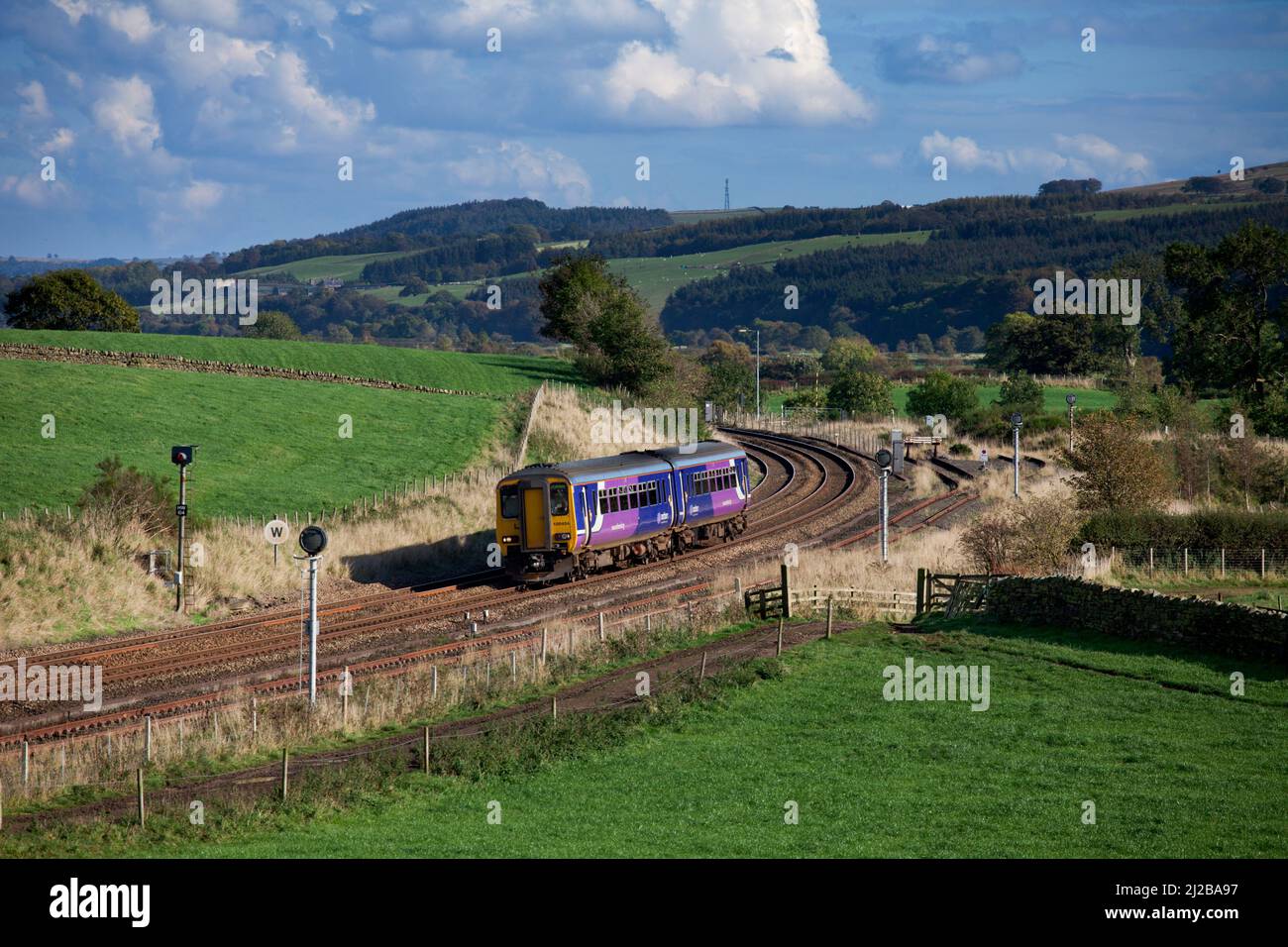 Northern rail class 156 sprinter train passing Whitchester on the scenic Tyne valley railway line Stock Photo