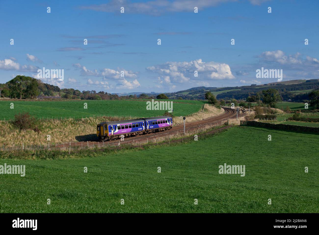 Northern rail class 156 sprinter train passing Whitchester on the scenic Tyne valley railway line Stock Photo