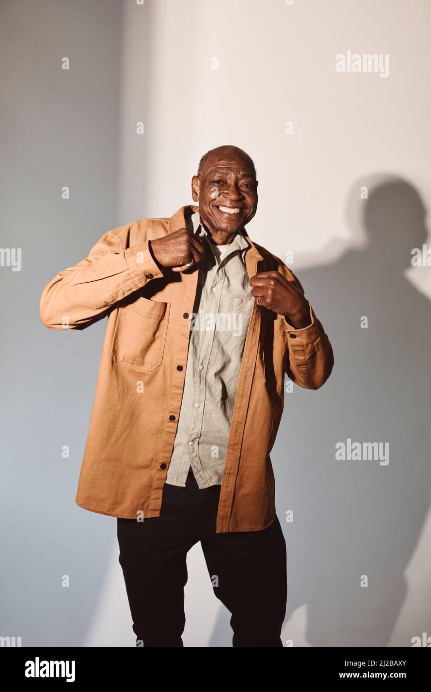 Happy senior man in casuals over white background Stock Photo - Alamy