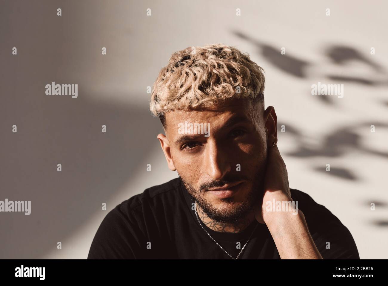 Portrait of young man over white background in studio Stock Photo - Alamy