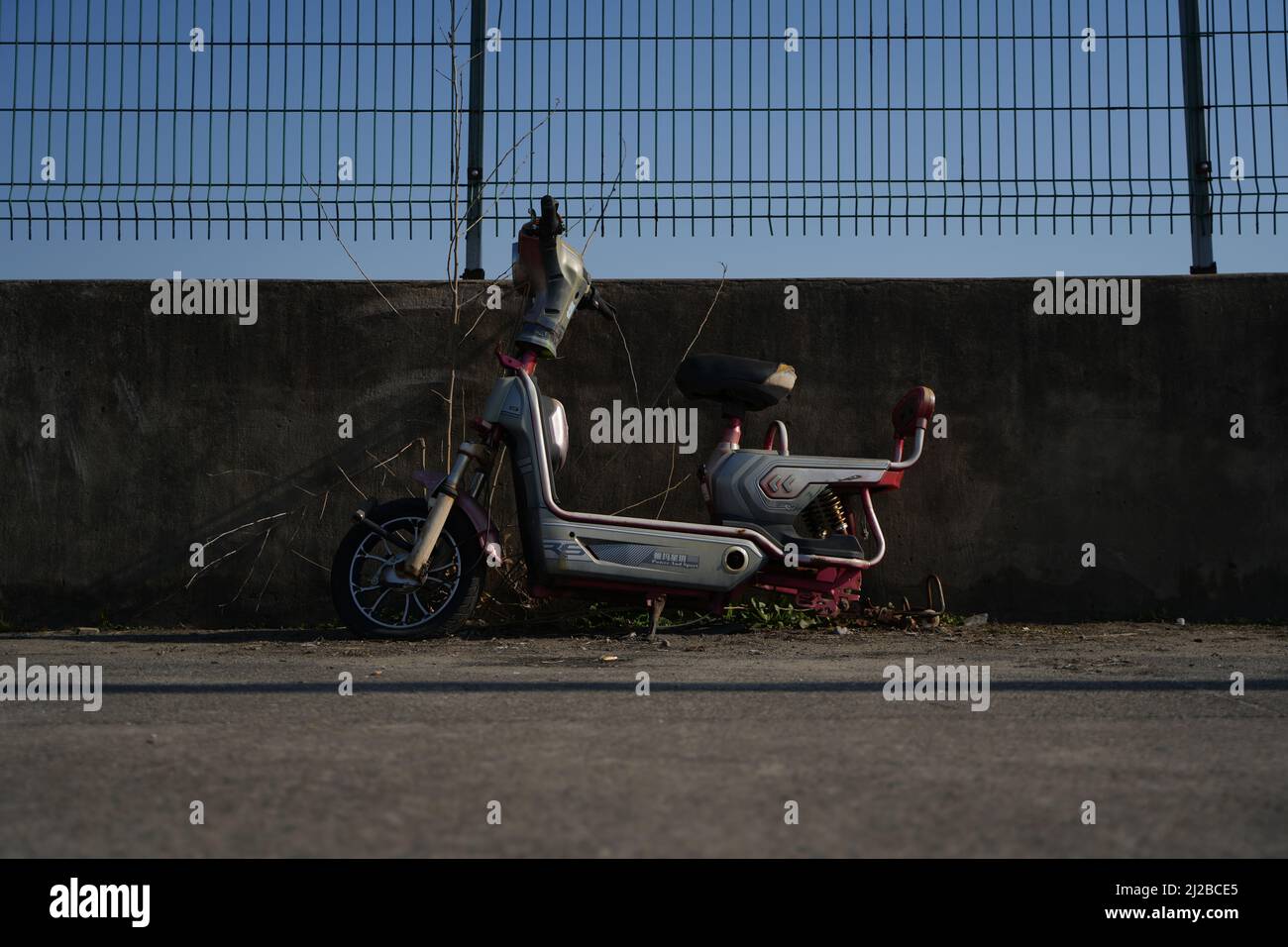 An abandoned scooter with no rear tire in Shanghai Stock Photo - Alamy