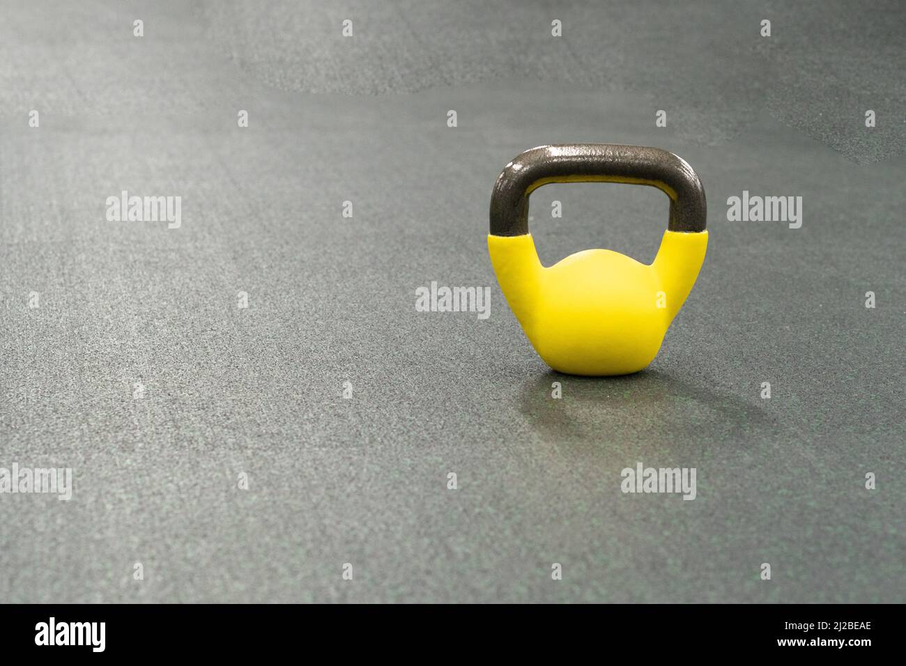 Yellow kettlebell weight healthy exercise, in the afternoon
