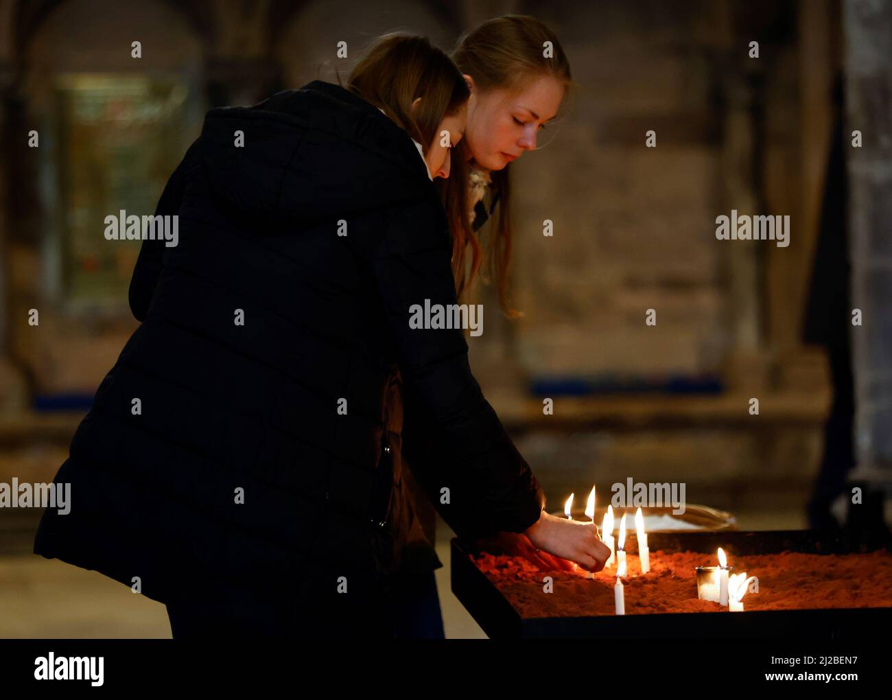 People light candles during 'Prayers for Ukraine', following Russia's