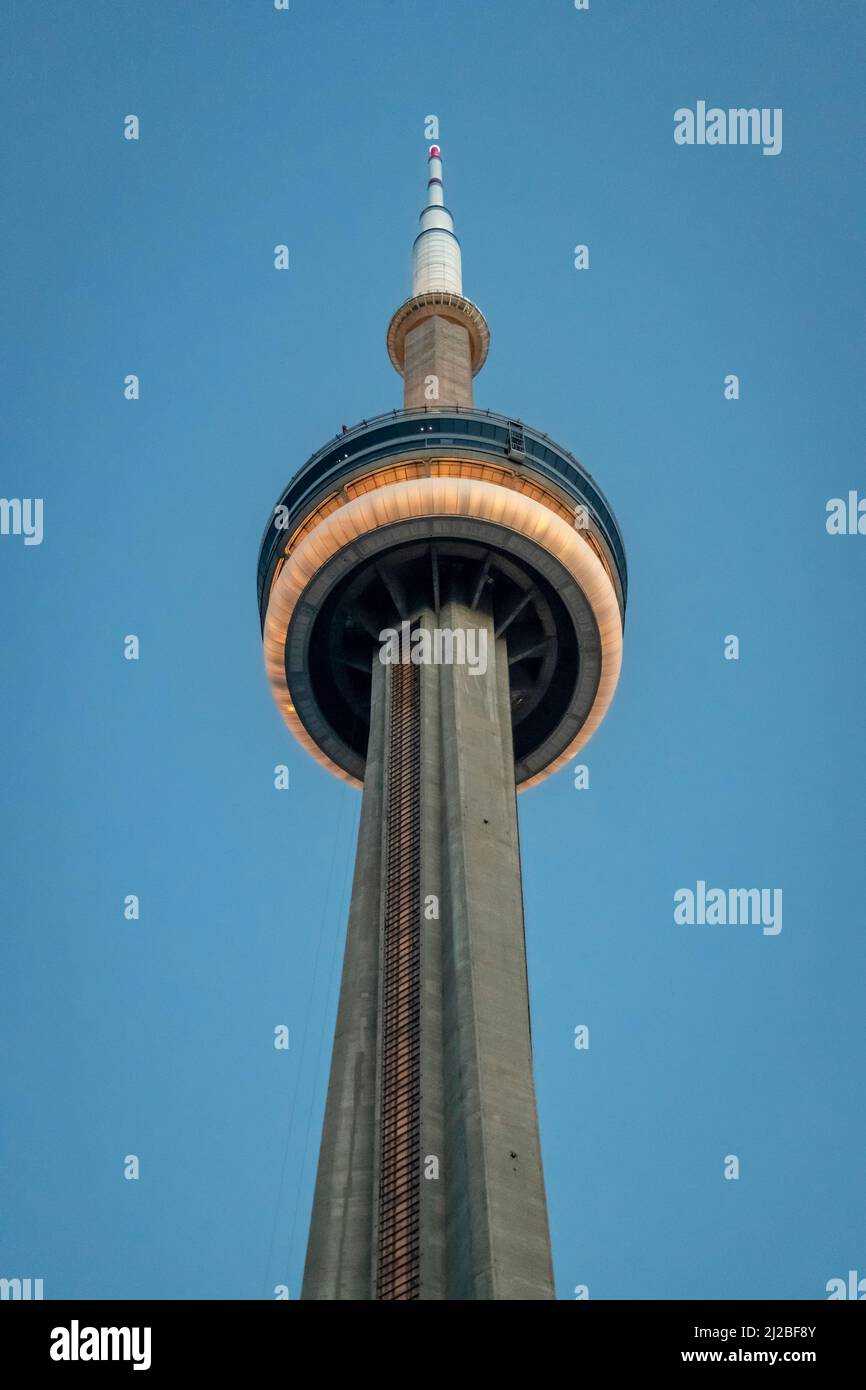 Toronto CN Tower illuminated at dusk Stock Photo - Alamy