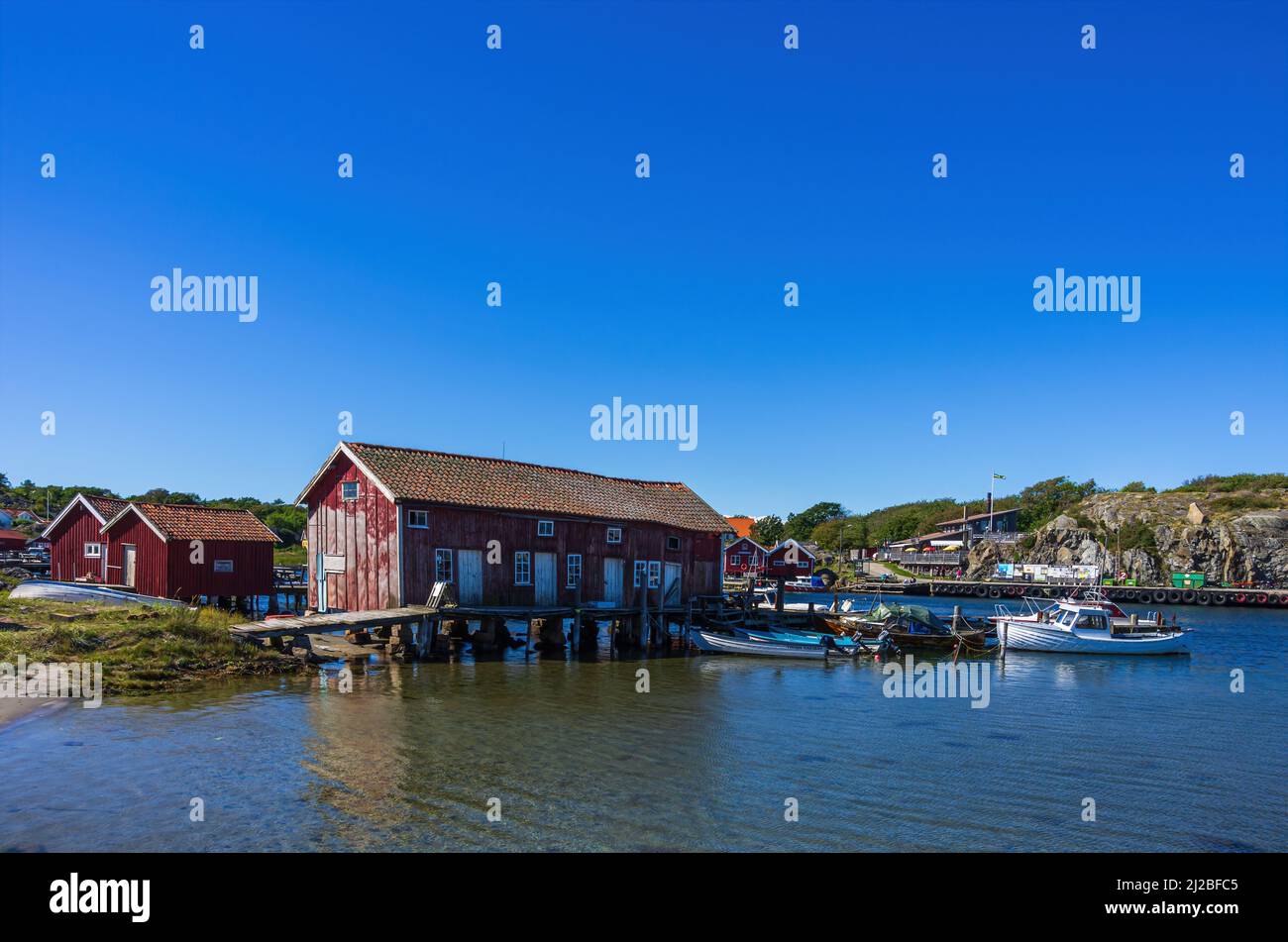 South Koster Island, Bohuslän, Västra Götalands län, Sweden: Picturesque view of maritime structures of boat sheds and boats. Stock Photo