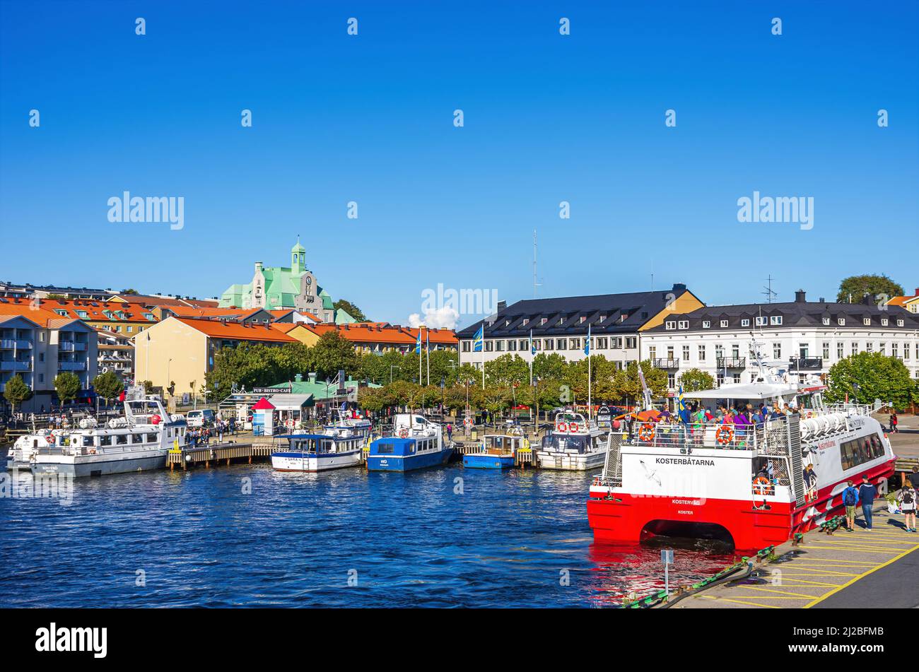 Strömstad, Bohuslän, Västra Götalands län, Sweden: Docked passenger ferry KOSTERVAG at the terminal and picturesque view of the waterfront. Stock Photo