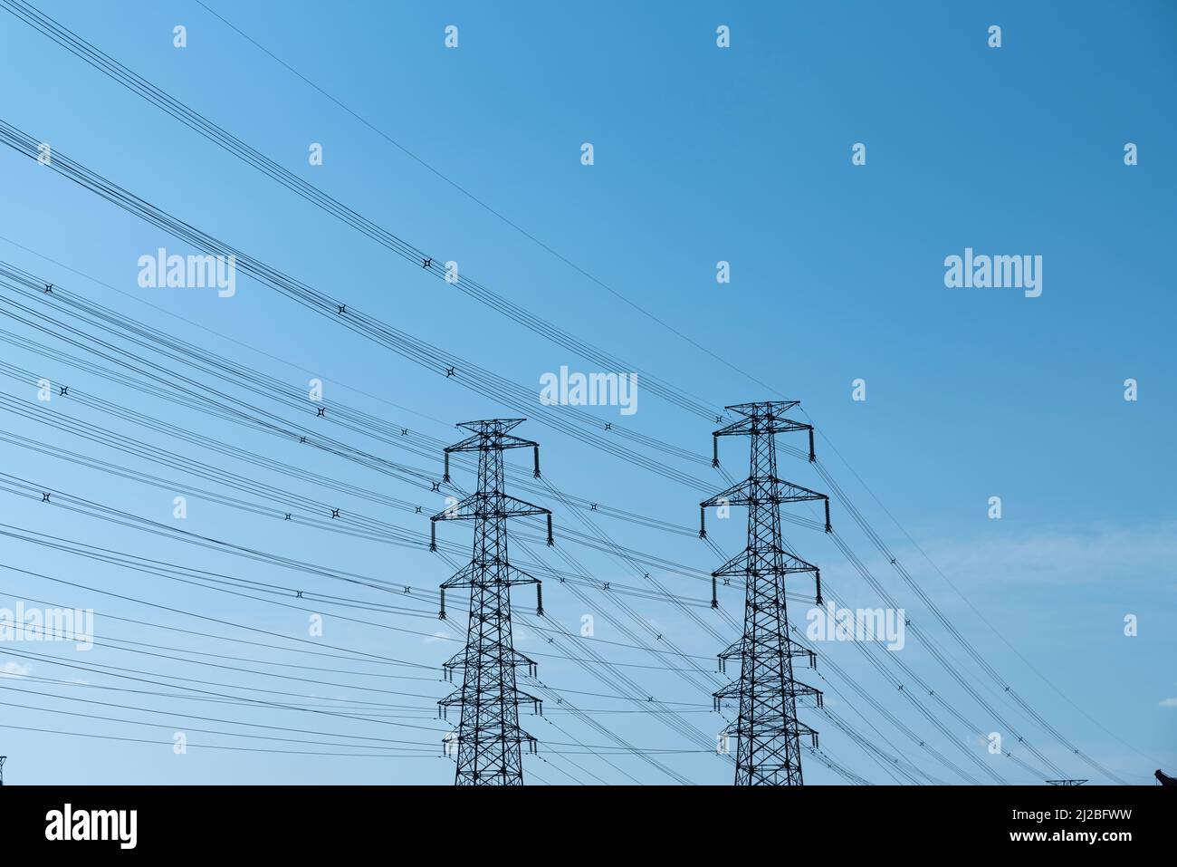 High voltage line under blue sky Stock Photo - Alamy