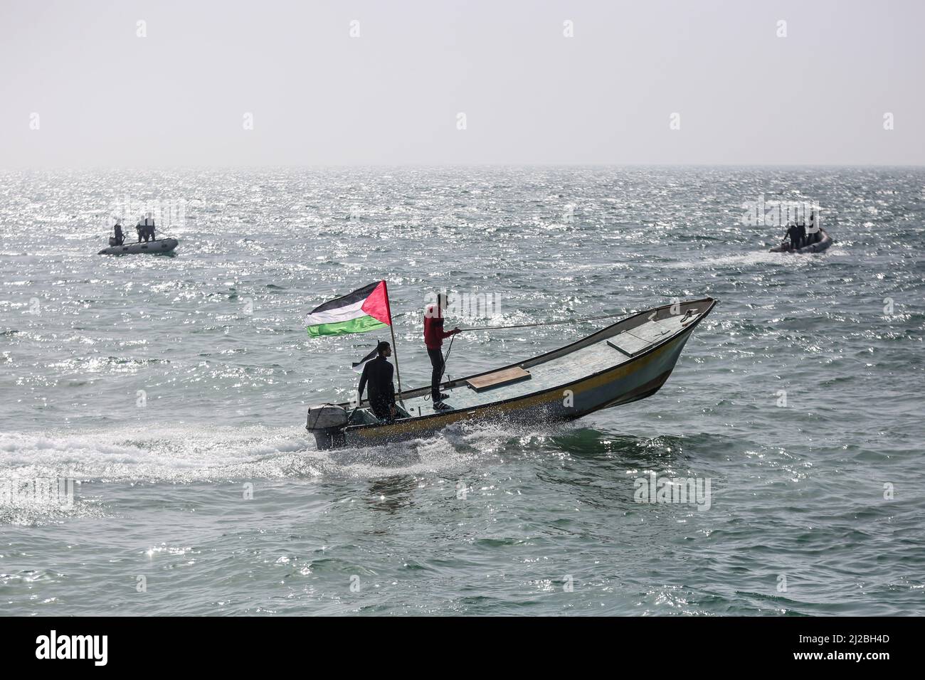 Gaza City. 30th March 2022. Palestinians participating at a march to commemorate the 46th anniversary of Earth Day, at the sea port in Gaza City. Stock Photo
