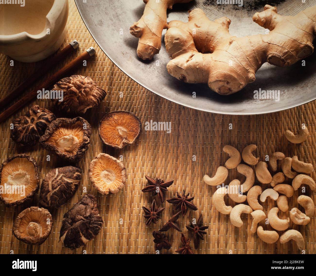 Asian Chinese food ingrediants, ginger,star anise, Chinese dried mushrooms, cashew nuts Stock Photo