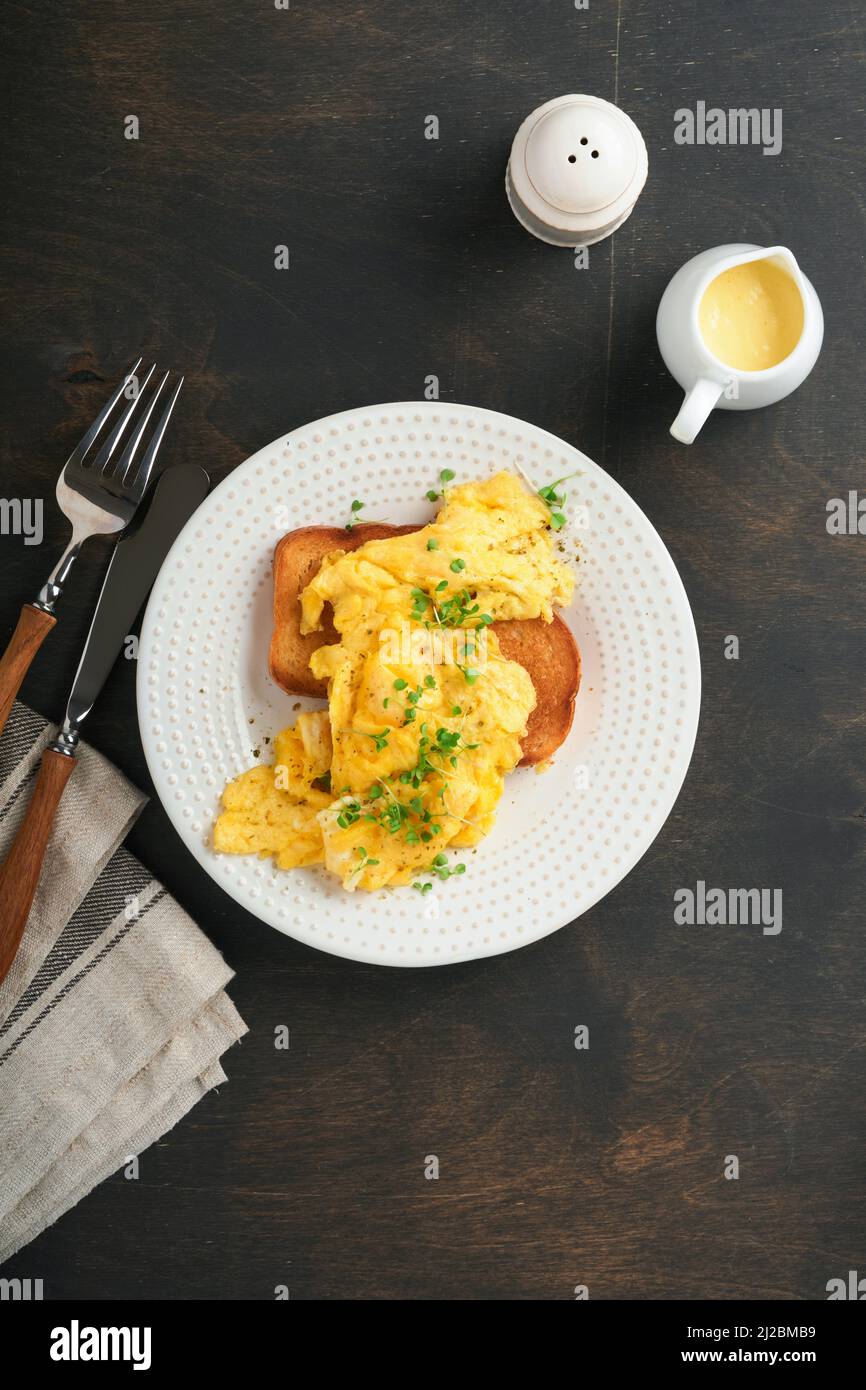 Scrambled Eggs. Fluffy and Buttery scrambled eggs on bread with