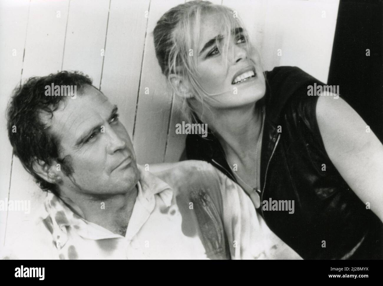 American model and actress Margaux Hemingway and actor Lee Major in the movie Killer Fish, 1987 Stock Photo