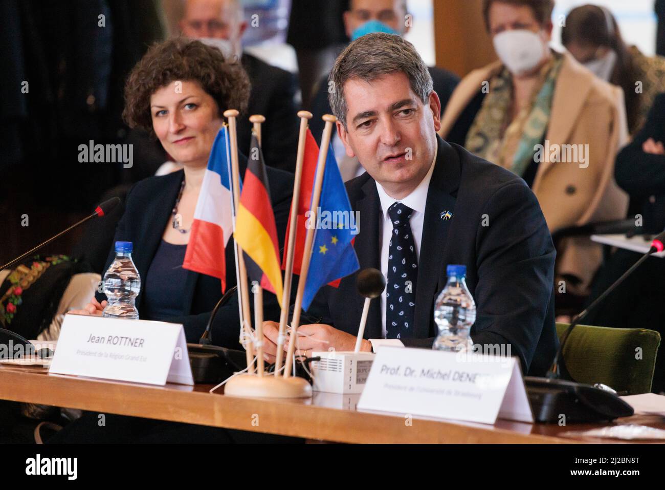 31 March 2022, France, Straßburg: Jeanne Barseghian (Europe Écologie-Les Verts, l.), mayor of Strasbourg, and Jean Rottner (Les Républicains, r), sit in a building at the University of Strasbourg during a conference on the EUCOR university network as part of a visit by a delegation from the Baden-Württemberg state government. Kretschmann has traveled to Strasbourg for political talks, where he hopes to strengthen relations with his French neighbor. Photo: Philipp von Ditfurth/dpa Stock Photo