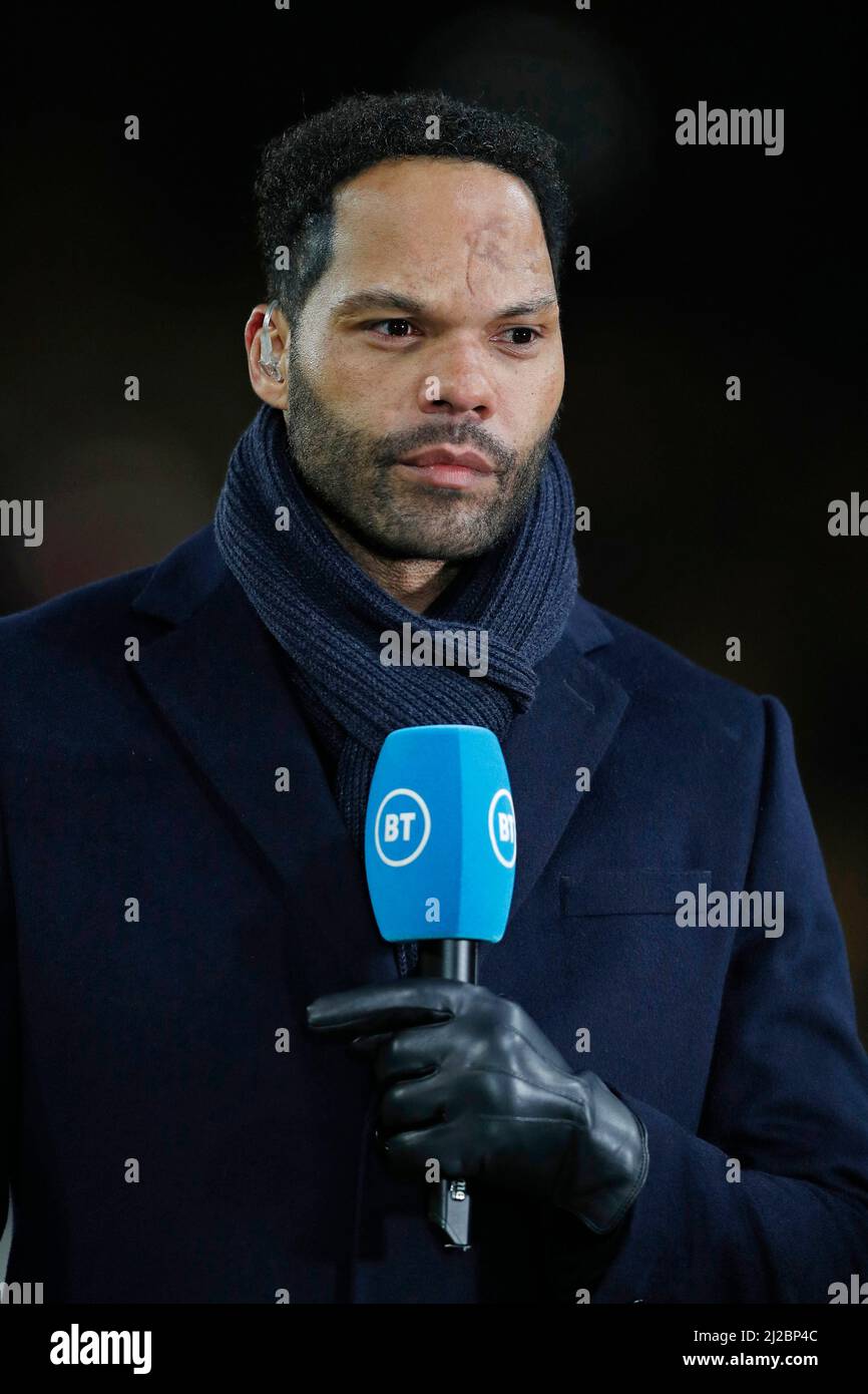 Television football pundit and former football player Joleon Lescott working on the sidelines before a football match at Molineaux Stadium. Stock Photo