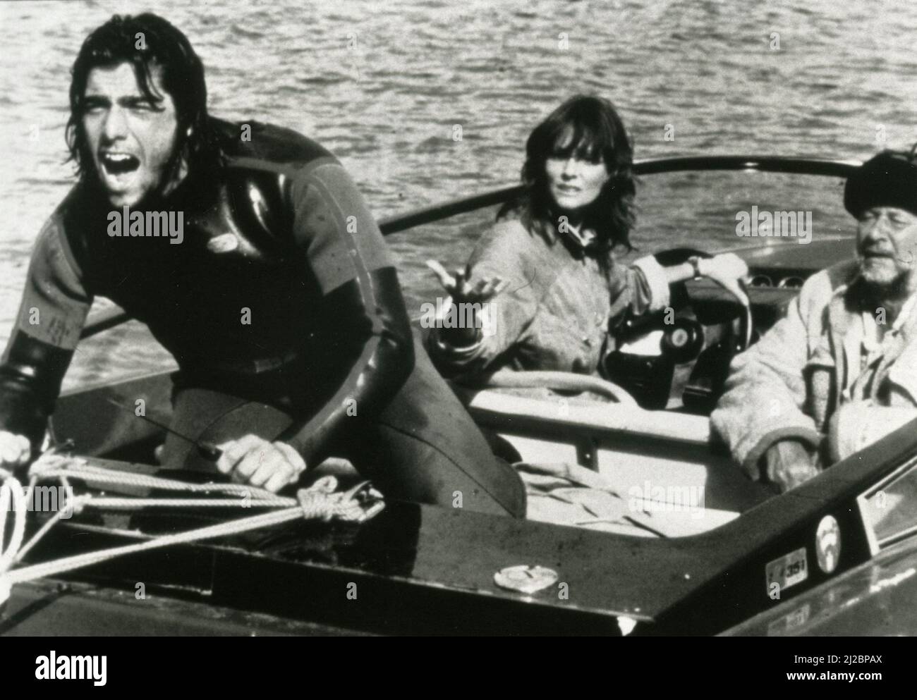 American actor Ken Wahl (left), actress Lesley Ann Warren, and actor Donald Pleasence in the movie Race For The Yankee Zephyr, Australia 1981 Stock Photo