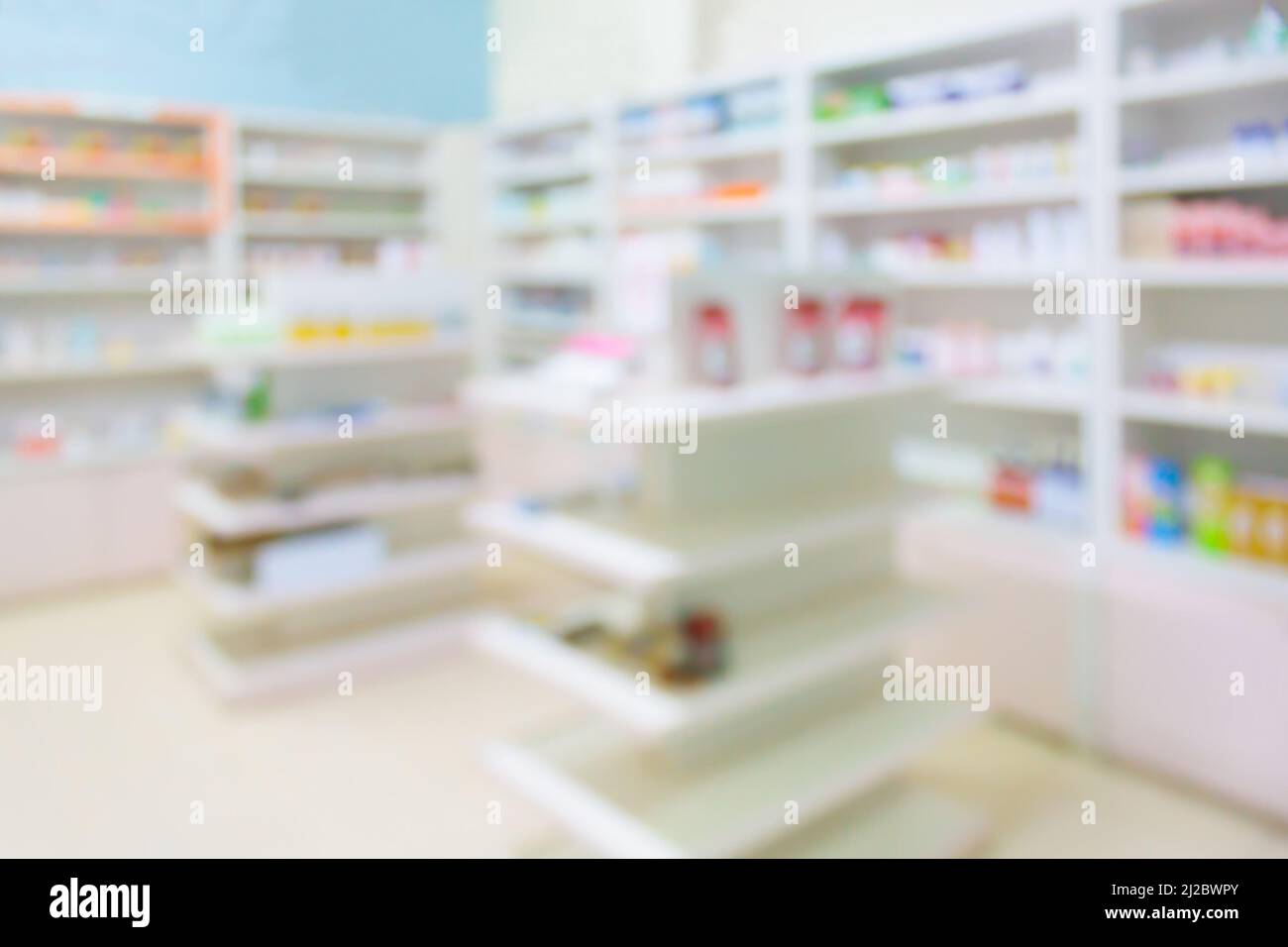 pharmacy store drugs shelves interior blurred background Stock Photo