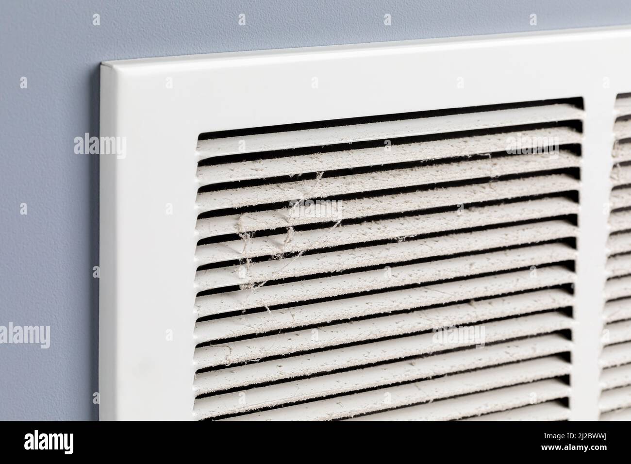 Dirty air vent in house. Household allergies, HVAC duct cleaning, maintenance and house cleaning concept. Stock Photo