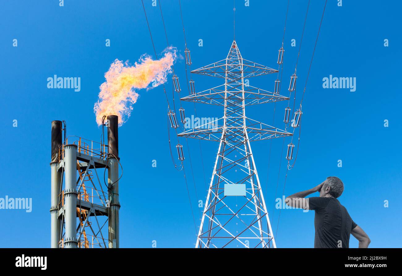Industrial gas flare stack/chimney and electricity pylon. Rising energy