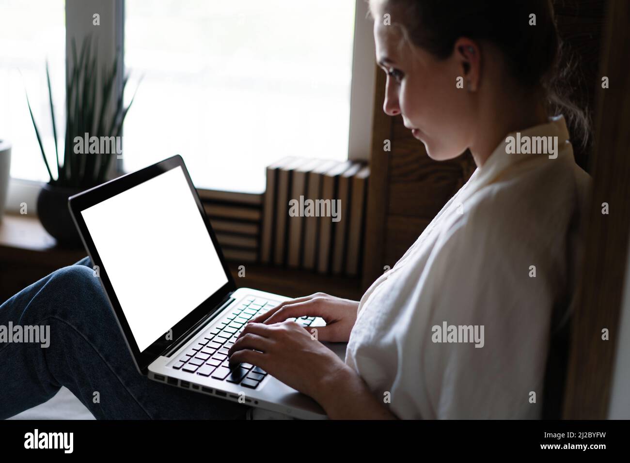 Mockup image of a woman using and typing on laptop computer keyboard ...