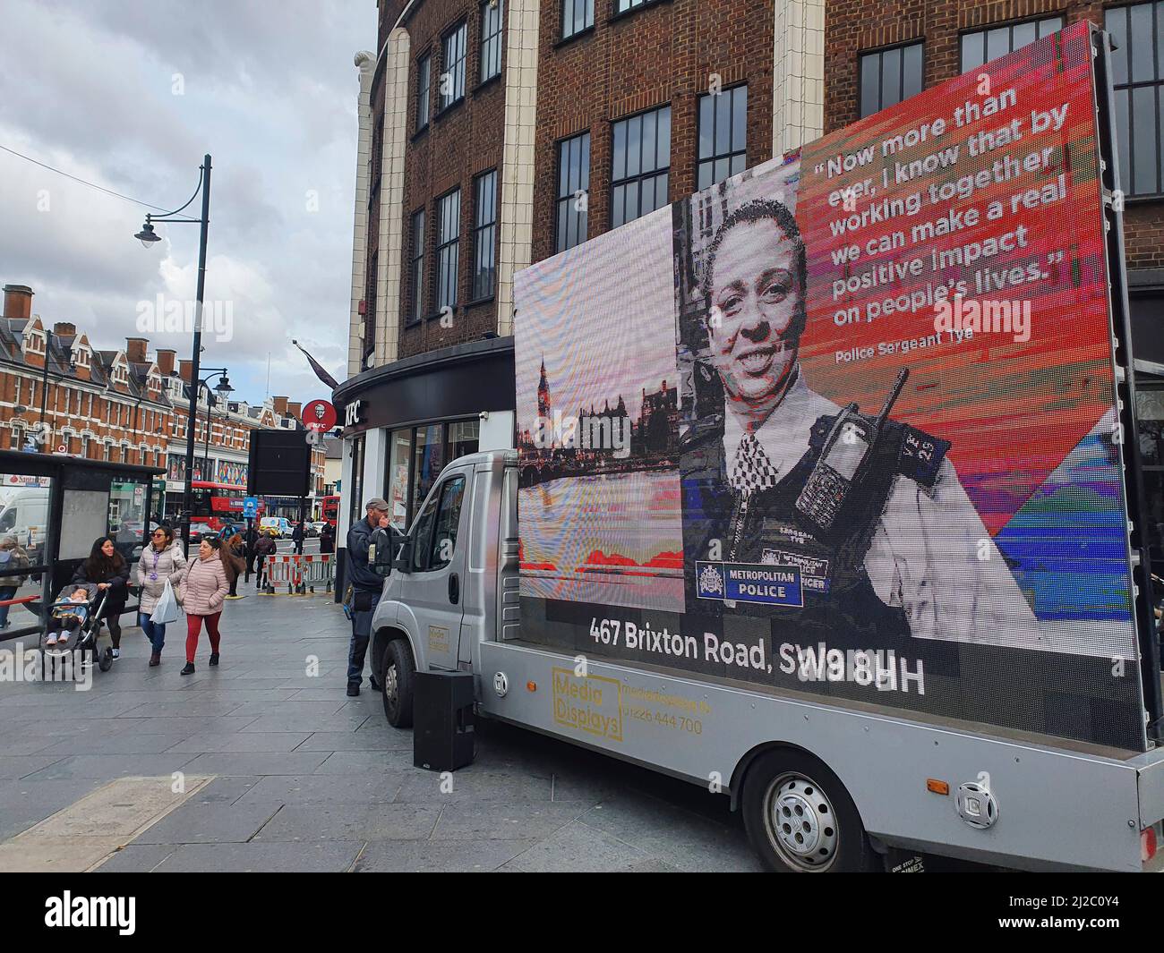 Brixton, UK, 31 March 2022: London's Metropolitan Police are trying to recruit new officers representing a more diverse range of ethnicities, genders and sexualities. Several recent scandals have highlighted the problems of racism, homophobia and misogyny within the police force and the Met's recruitment drive includes this advertising van in central Brixton with an LED screen and speakers broadcasting that 'now more than ever' new recruits are needed to improve diversity, inclusion and representation within London's police. Anna Watson/Alamy Live News Stock Photo