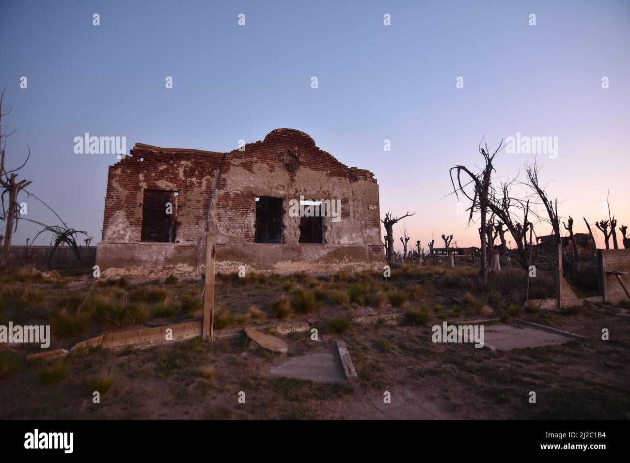 The old destroyed building ruins at sunset Stock Photo - Alamy