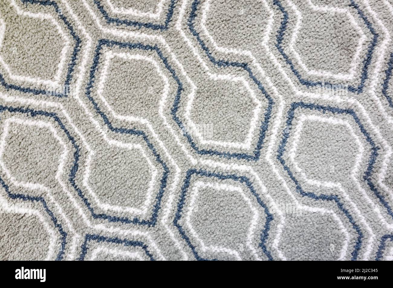 Geometric carpet pattern, top view, background photo texture Stock