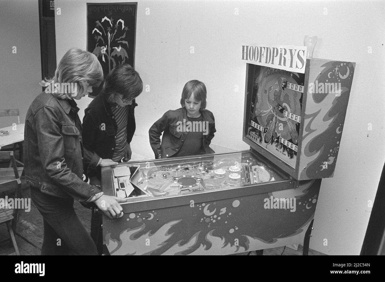 Pinball championships on Museumplein Amsterdam, boys watch pinball