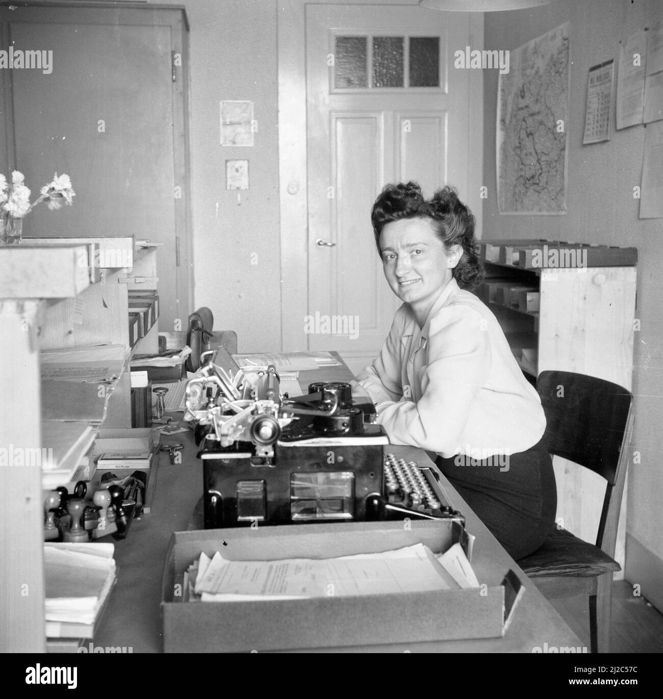 Marietta, Georgia: c. 1953 A woman in an office using an IBM 650