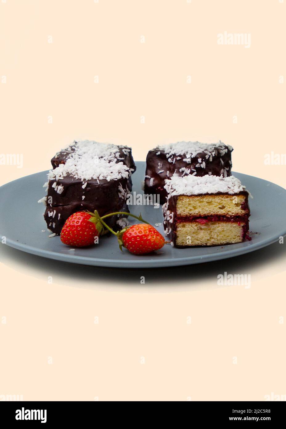 Traditional Australian lamington cakes with strawberry jam, chocolate