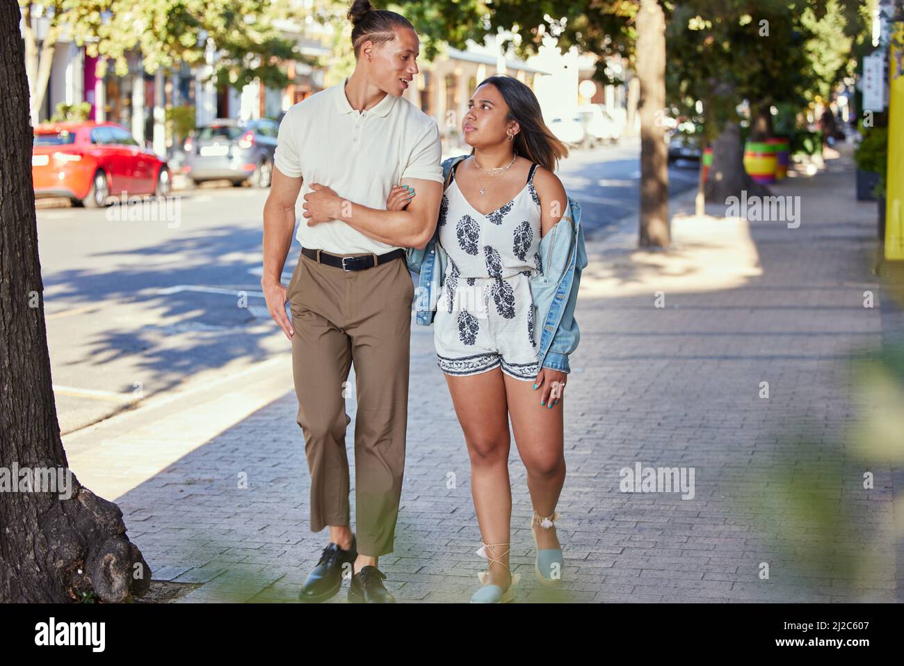A pathway to love. Shot of a young couple walking in the city. Stock Photo