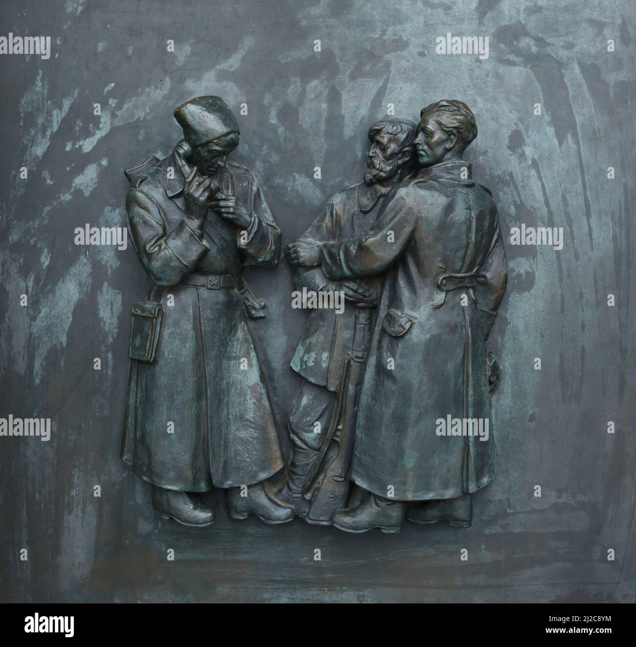 Slovak partisans during World War II depicted in the bronze relief by Slovak sculptor Rudolf Pribiš placed on the main door to the Slavín Memorial in Bratislava, Slovakia. The war memorial devoted to Red Army soldiers fallen during World War II was designed by Slovak architect Ján Svetlík and build between 1957 and 1960. Stock Photo