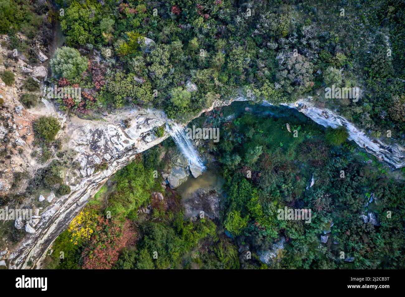 Seasonal waterfall of Prastio in Cyprus appears after winter rains. Drone panorama, top view Stock Photo