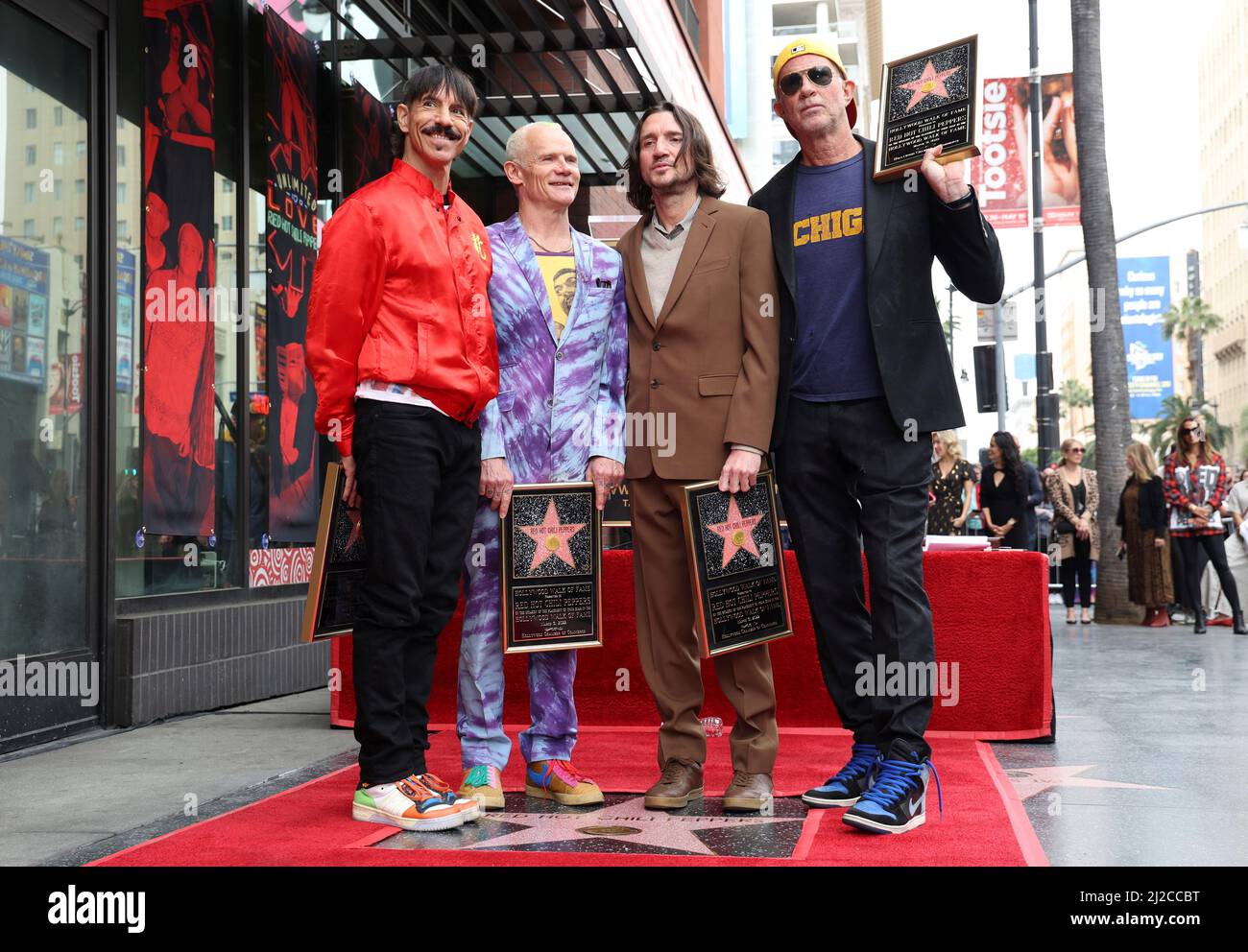 Anthony Kiedis, Michael Balzary (Flea), John Frusciante and Chad Smith of  American rock band Red Hot Chili Peppers pose during the ceremony to unveil  the band's star, on the Hollywood Walk of