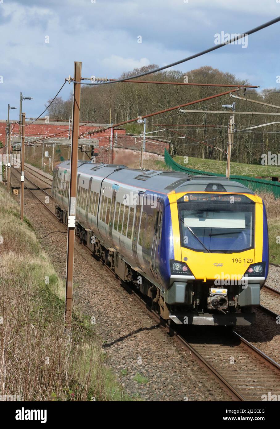 Norther trains Civity dmu, number 195129, on West Coast Main Line near Garstang, with Manchester Airport to Barrow service on 31st March 2022. Stock Photo