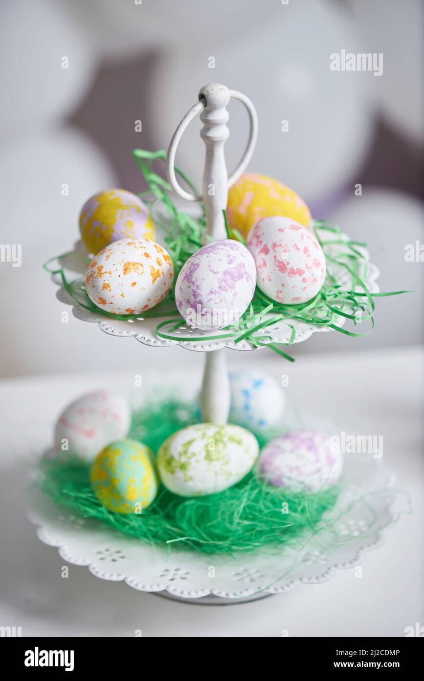 Easter eggs in a double plate on a table with a copy space Stock Photo
