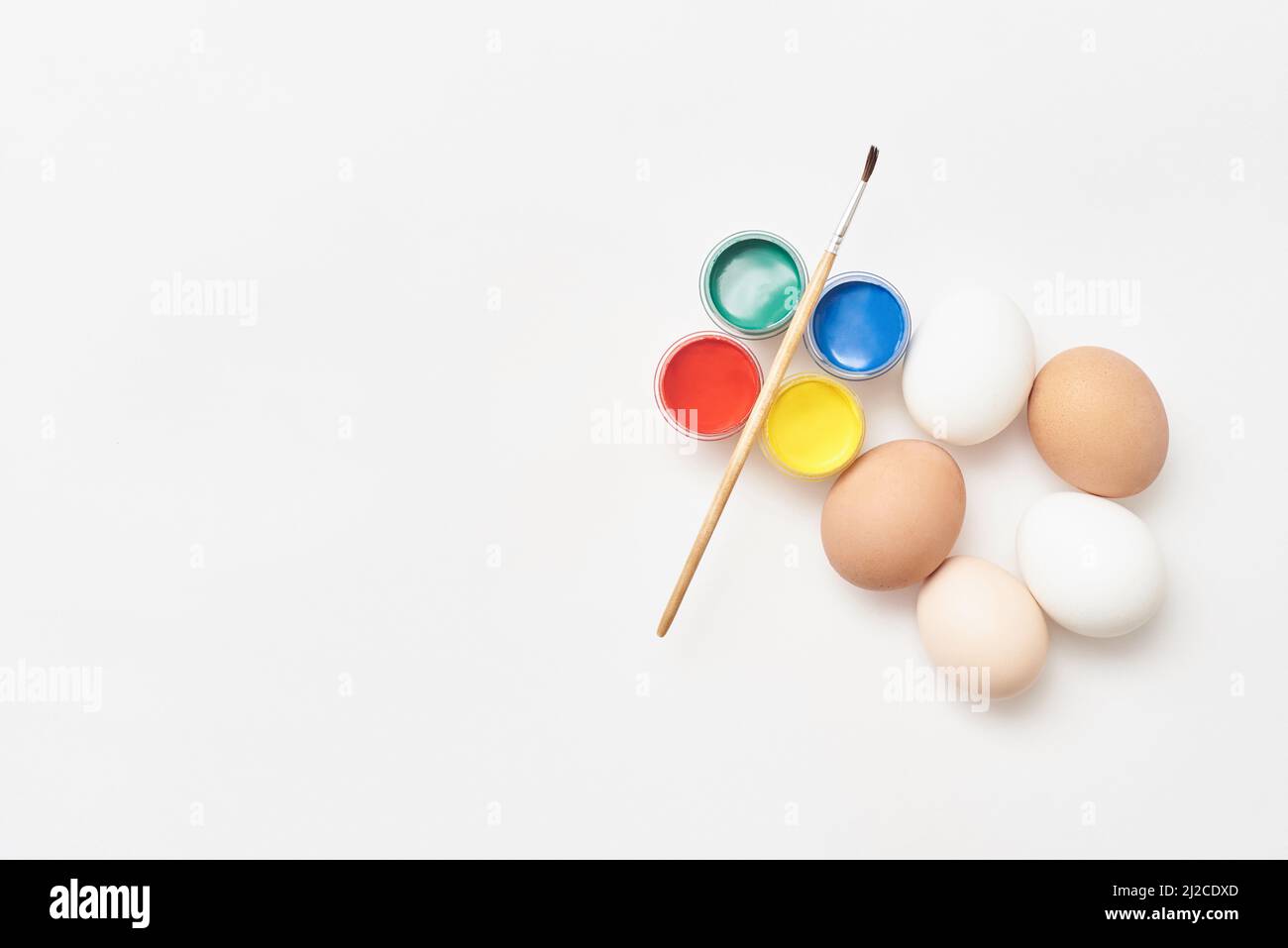 Chicken eggs and paints Stock Photo